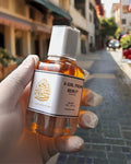 100ml amber glass parfum spray bottle of A Girl From Beirut by Ibn Al Jebouri, featuring a 40% oil concentration.