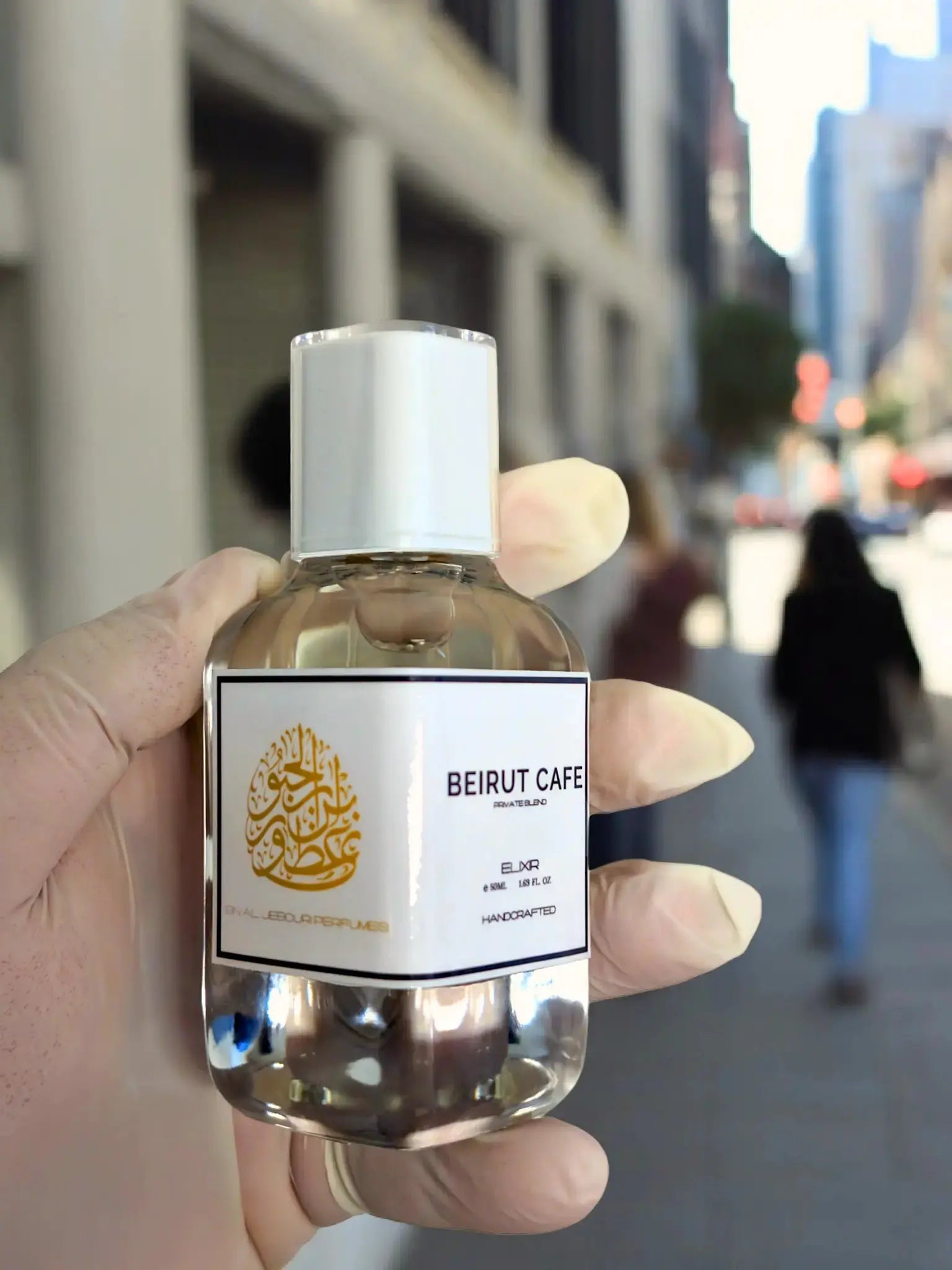 Beirut Cafe Elixir de Parfum Spray 100ml bottle showcased in an urban setting, highlighting its luxurious and handcrafted essence